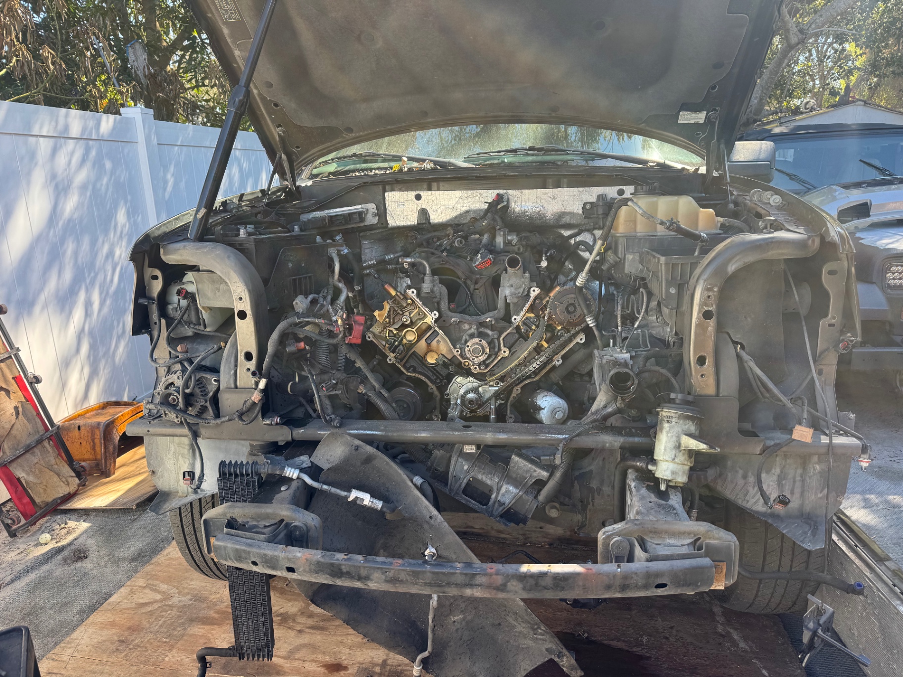 Engine bay with timing cover removed during major repair